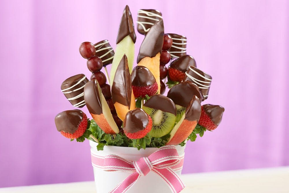 Chocolate-Dipped Fruit on sticks inside of a flower pot